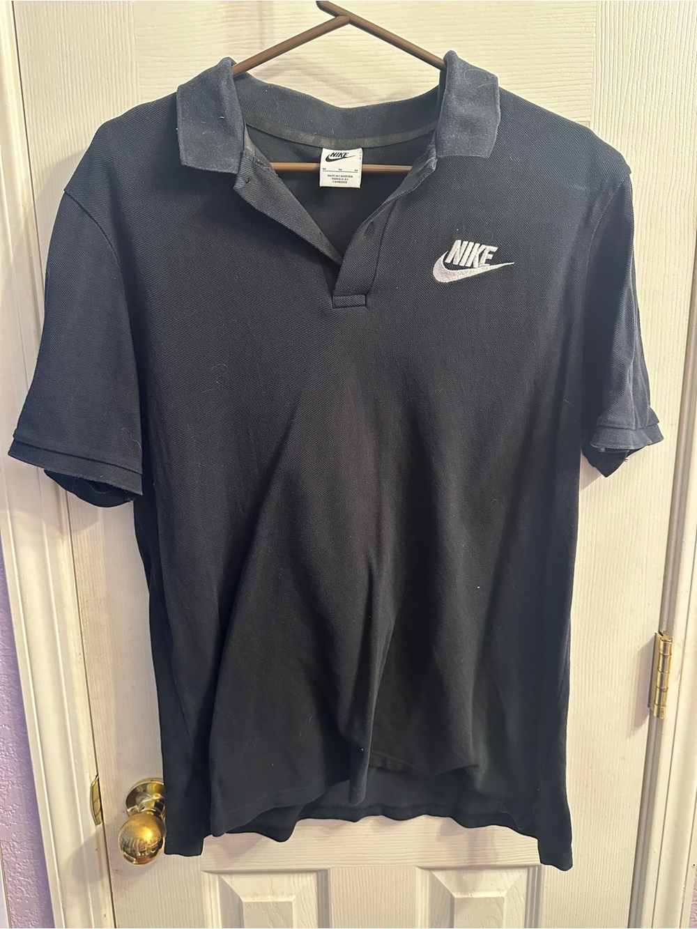 Men’s Nike Black Polo with White Swoosh Logo